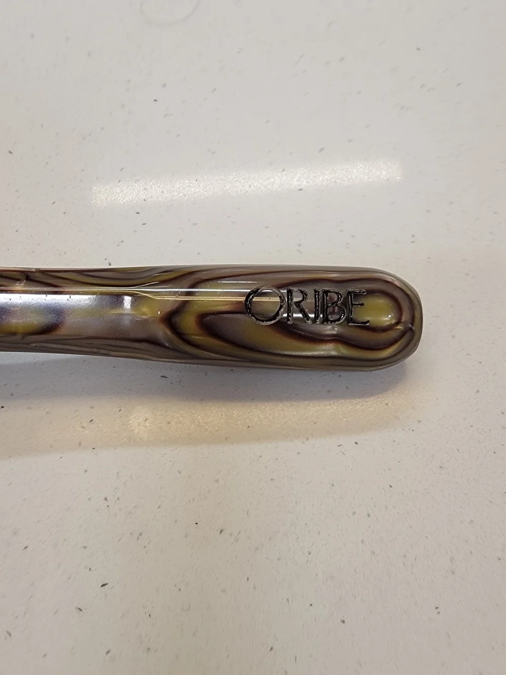 Oribe Round Styling Brush in Brown and Black